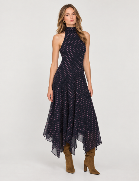 sleeveless high-neck midi dress with a navy base and small white and pink polka dots